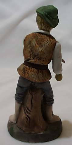 Bisque porcelain boy, dog & bone figurine