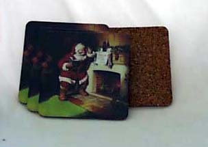 Coasters of Santa by a fire place with a Coke