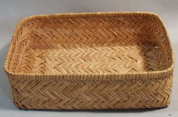 Oblong basket woven of Straw