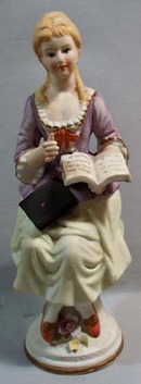 Dainty School teacher sitting on a bench