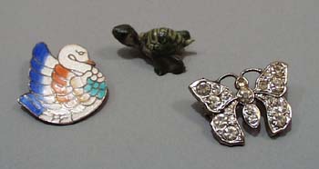 3 PC pins and turtle.