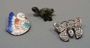 3 PC pins and turtle.