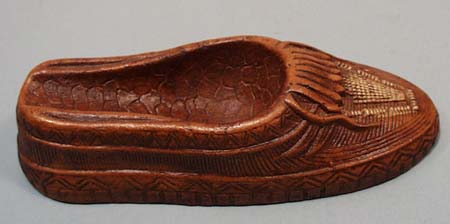 Redwood moccasin pipe holder