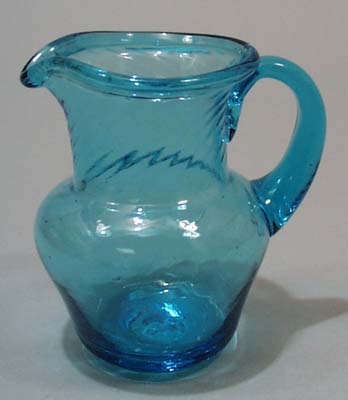 Hand blown mini pitcher with turned lip