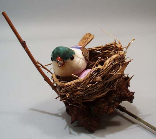 Flower pick bird nest.