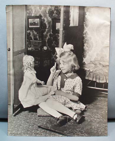 1910 photo girl talks to doll
