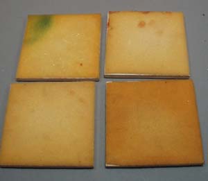 4 coaster tiles featuring Hercules, Minerva, roman soldiers