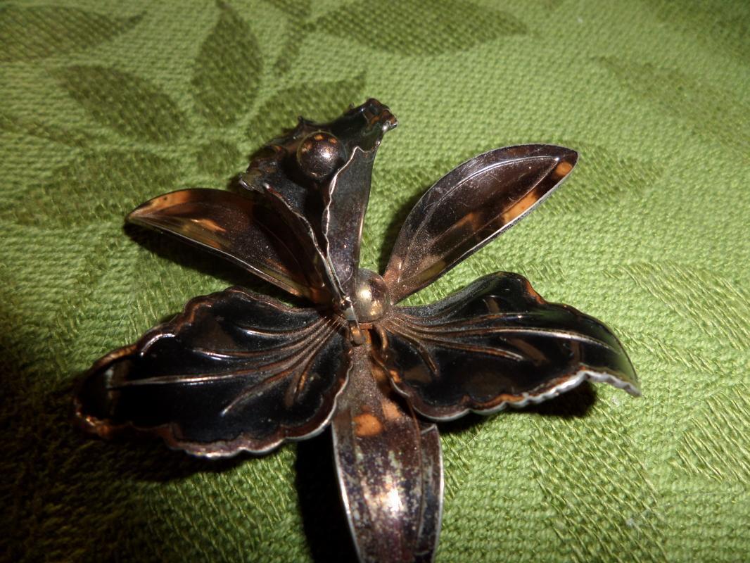 Gold tone with black brooch
