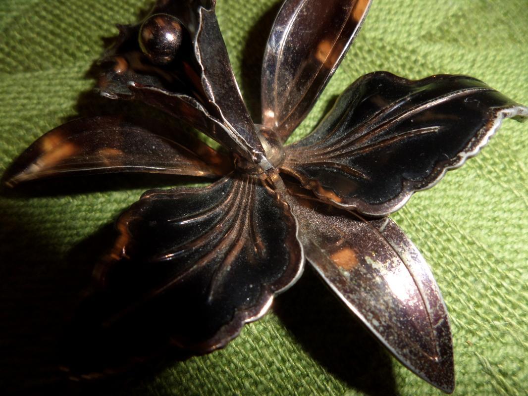 Gold tone with black brooch