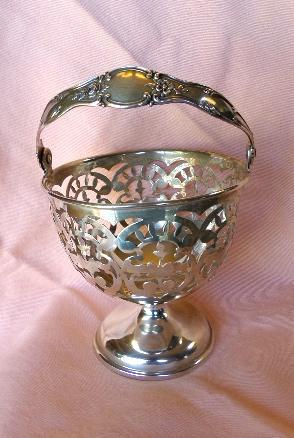 Sterling silver Ornate urn shaped pierced serving piece with handle