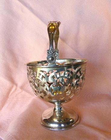 Sterling silver Ornate urn shaped pierced serving piece with handle