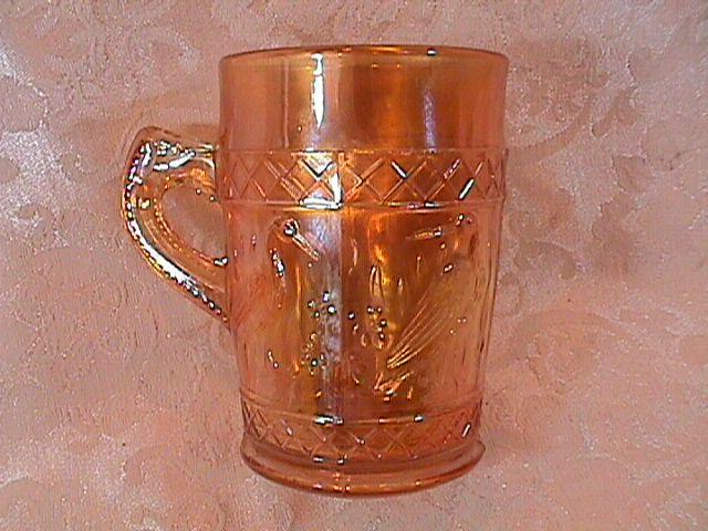 CARNIVAL GLASS STORK and RUSHES MUG MARIGOLD