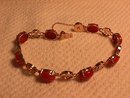 14K Solid Gold and Genuine Coral Asian Motif Bracelet