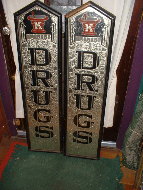 A Pair of Vintage Reverse Painted Drug Store Signs