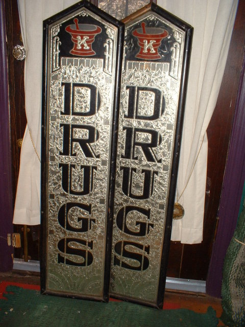A Pair of Vintage Reverse Painted Drug Store Signs