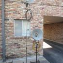 VERY RARE! PAIR OF VINTAGE PHOTOGENIC MACHINE CO. INDUSTRIAL MACHINE AGE STEAM PUNK MID-CENTURY MODERN ADJUSTABLE FLOOR LAMPS FLOODLIGHTS MODEL LIGHT ON IRON WHEEL BASE CASTERS