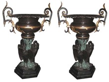 70.2606 Pair of Large Bronze Urns with Three Herons at Base