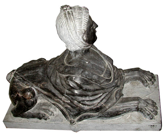 68.5867 Pair of Black Marble Sphinxes.