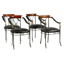 7401 A stylish set of four chrome and bronze chairs, each having swan decorated arms and upholstered seats circa 1920.