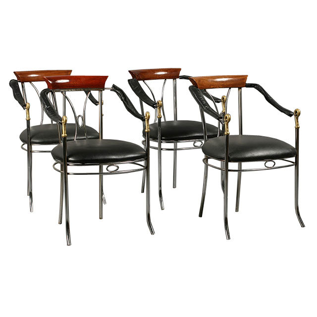 7401 A stylish set of four chrome and bronze chairs, each having swan decorated arms and upholstered seats circa 1920.