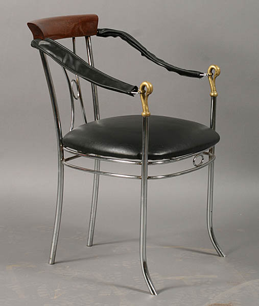 7401 A stylish set of four chrome and bronze chairs, each having swan decorated arms and upholstered seats circa 1920.