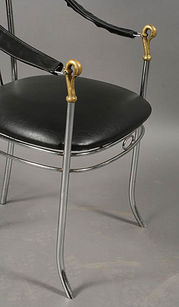 7401 A stylish set of four chrome and bronze chairs, each having swan decorated arms and upholstered seats circa 1920.