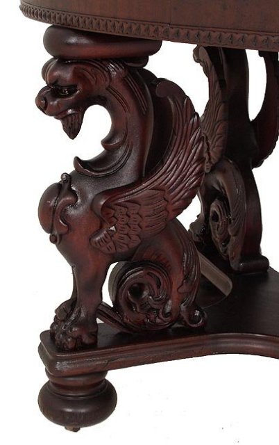 Carved top mahogany griffen oval table