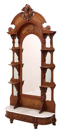 Walnut Victorian etagere with carved head