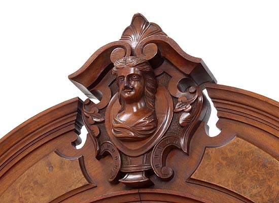 Walnut Victorian etagere with carved head
