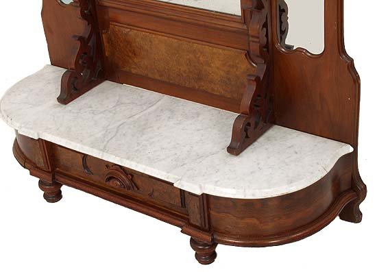 Walnut Victorian etagere with carved head