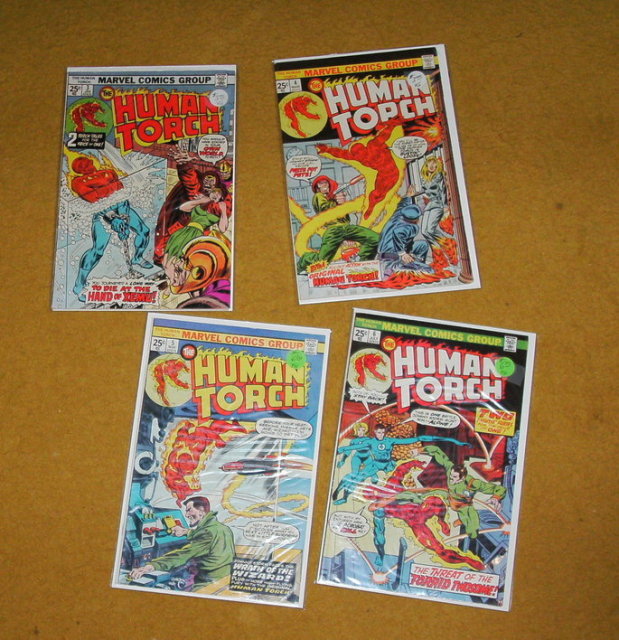 Four Human Torch comic books mostly fine