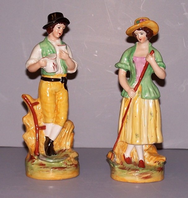 Pair of Boy and Girl Staffordshire Figurines