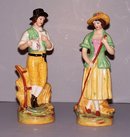 Pair of Boy and Girl Staffordshire Figurines