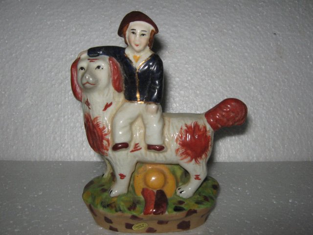 Porcelain Man riding Dog
