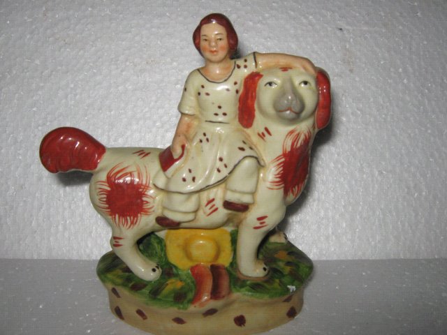Porcelain Man riding Dog