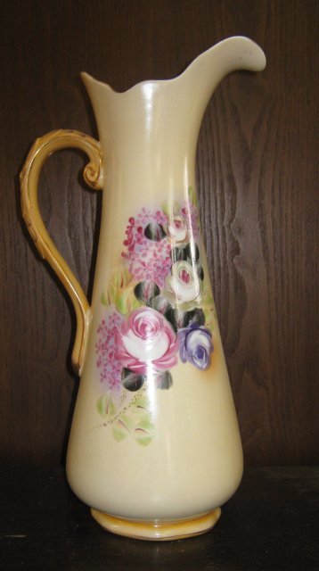 Tall Pale yellow pitcher with roses