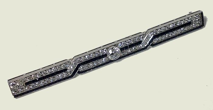 J. E. Caldwell Diamond, Onyx Platinum Bar Brooch, American, C.1930.