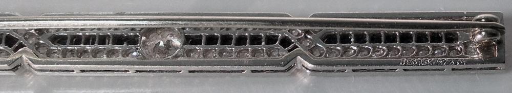 J. E. Caldwell Diamond, Onyx Platinum Bar Brooch, American, C.1930.