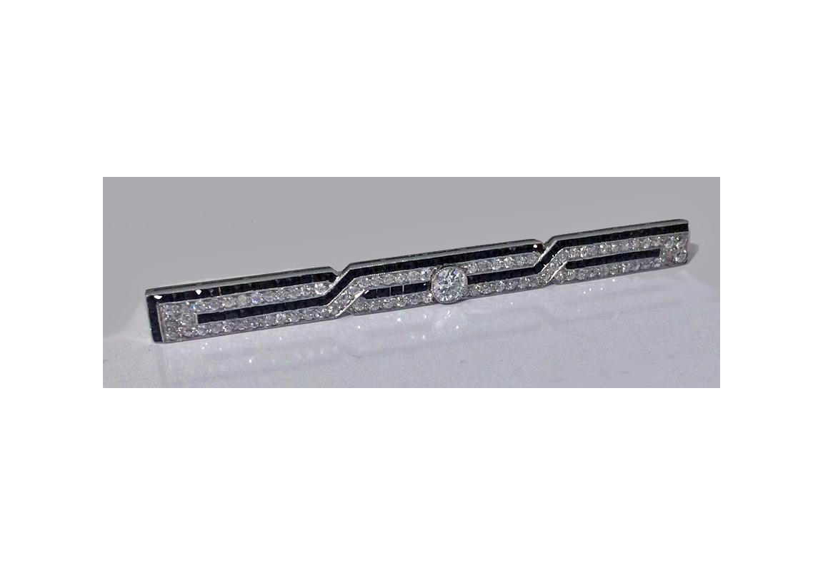 J. E. Caldwell Diamond, Onyx Platinum Bar Brooch, American, C.1930.