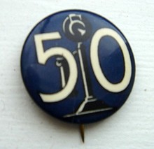 CELLULOID PINBACK BUTTON-IMAGE OF CANDLESTICK TELEPHONE & NO. 50