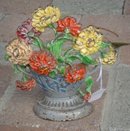 PAINTED CAST IRON BASKET OF FLOWERS DOORSTOP
