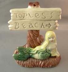 Older Aquarium Ornament Mermaid and Topless Beach Sign