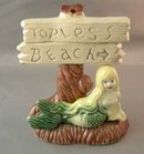 Older Aquarium Ornament Mermaid and Topless Beach Sign