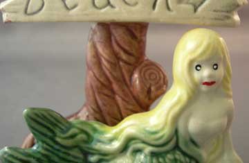Older Aquarium Ornament Mermaid and Topless Beach Sign