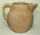 Old Brush McCoy Flower Embossed Tan Pitcher
