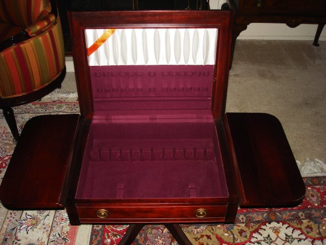 Drop leaf silver storage table