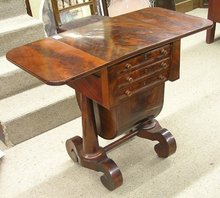 American Empire drop-leaf flame mahogany sewing table