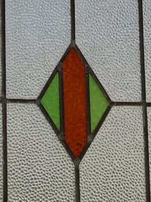 Green and Dark Orange Diamond Antique Stained Glass Window