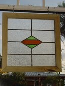 Green and Dark Orange Diamond Antique Stained Glass Window