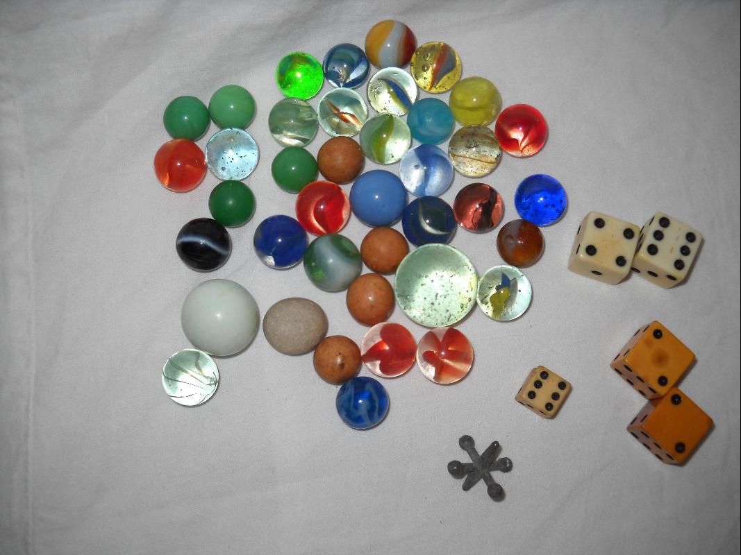 Vintage marbles and dice, one jack